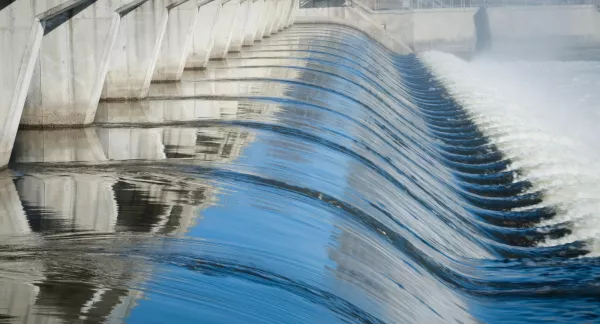 Artificial dam with flowing water